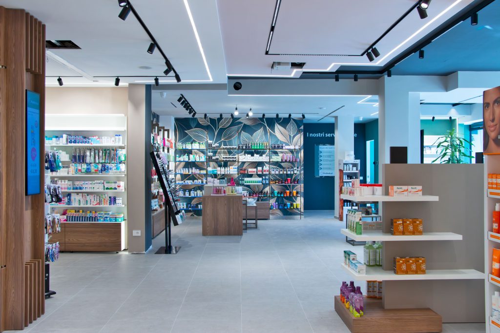 Modern pharmacy interior showcasing organized shelves of health and beauty products in a bright, welcoming environment.
